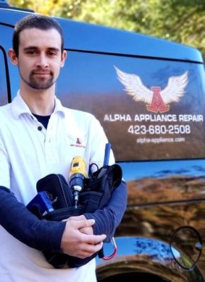 Alpha Appliance Service technician in front of service van